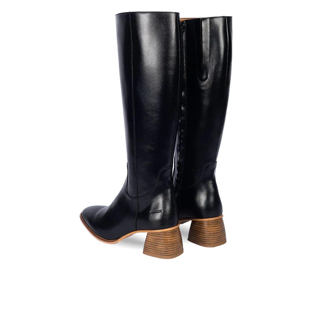 Long shafted boot with sculptural block heel